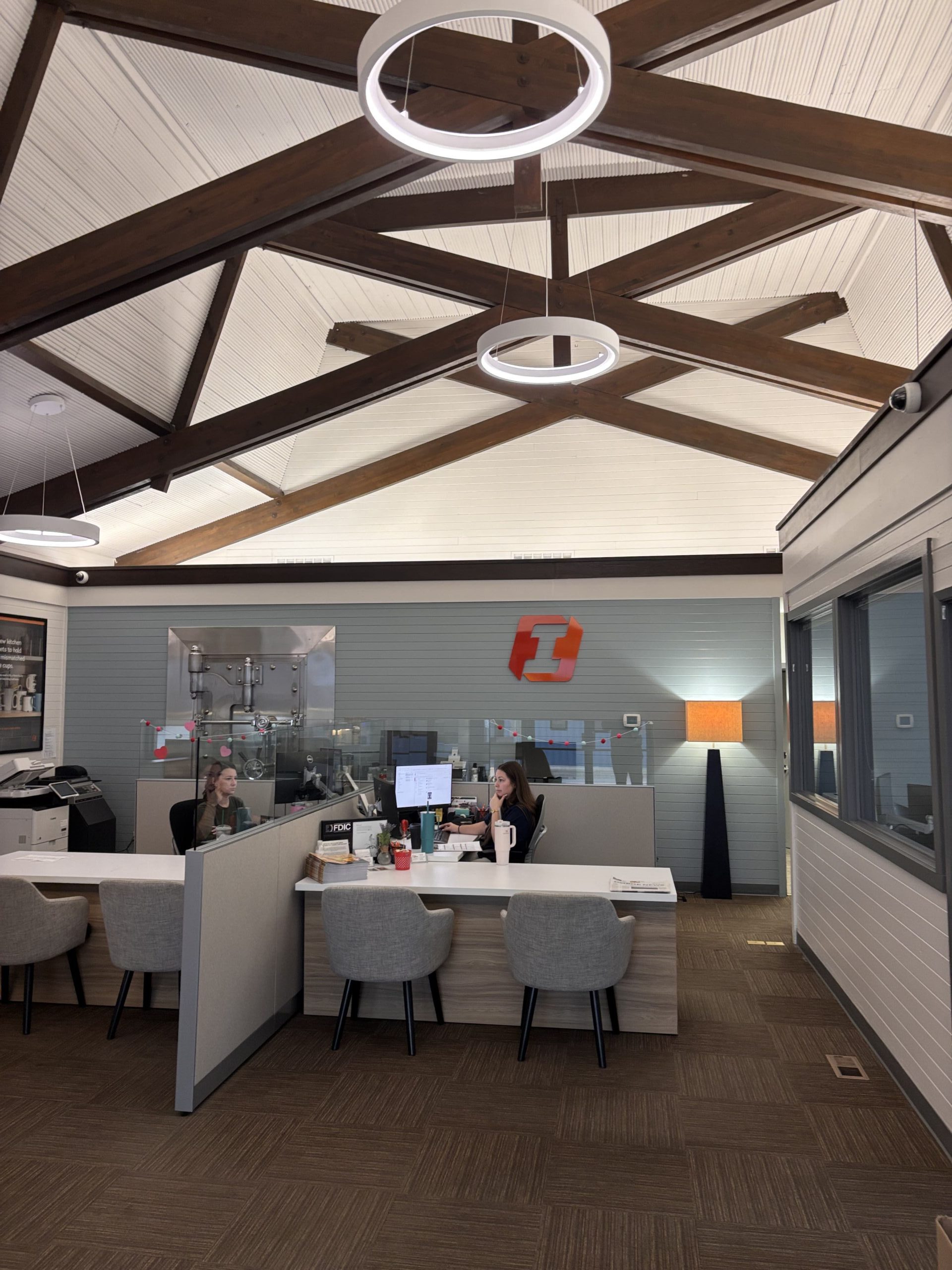 Modern bank office interior with vaulted ceilings.